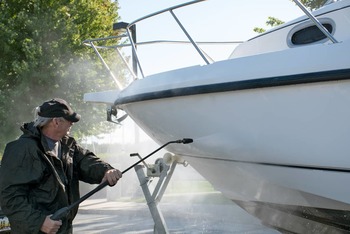 Thumb man cleaning a boat hull