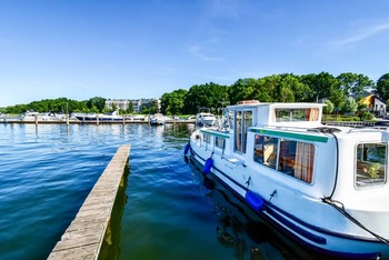 Thumb houseboats and yachts are moored in goehren lebbin  germany 