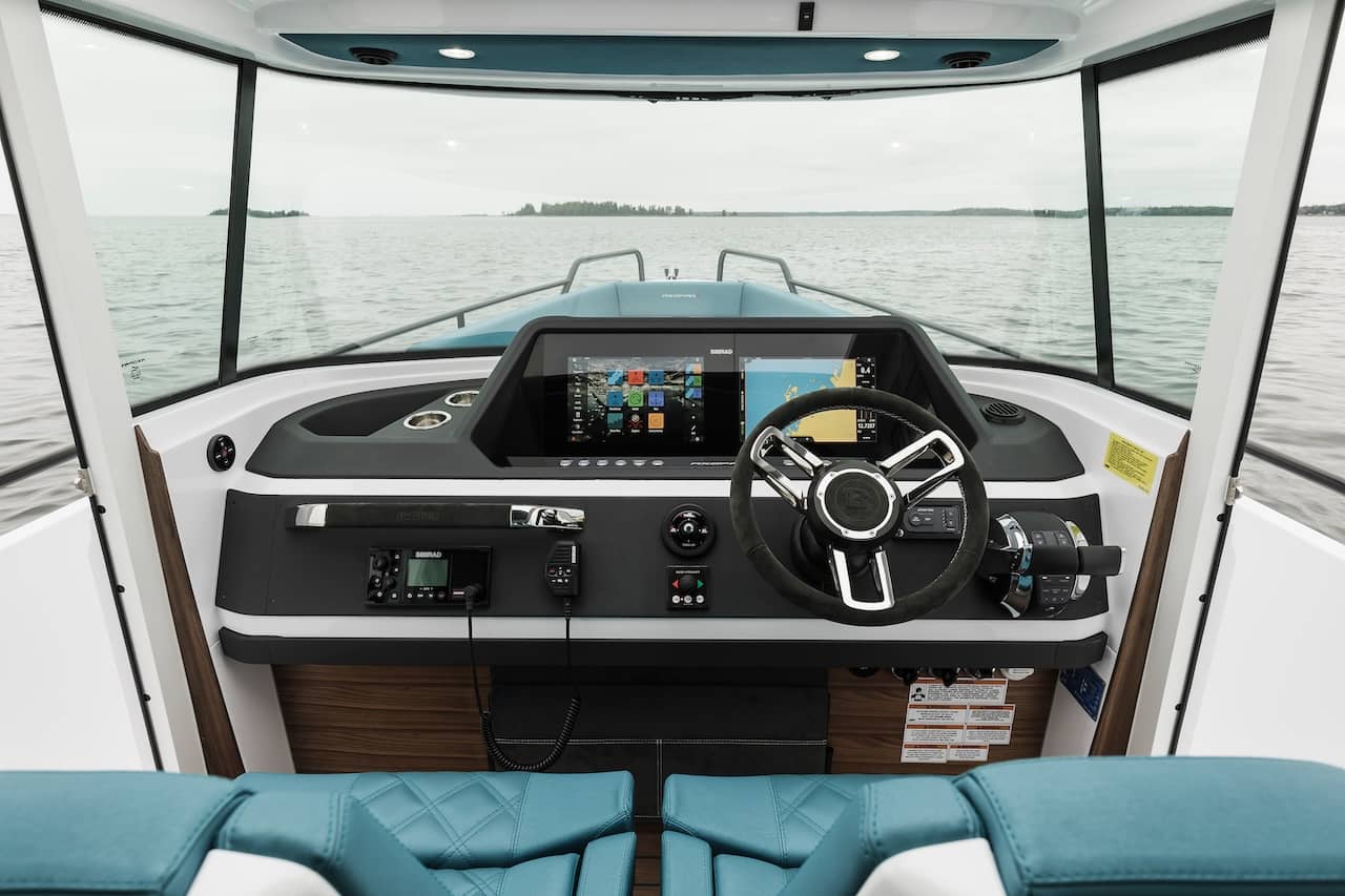 The Axopar 28 Cabin has a simple yet functional dashboard inside a fully enclosed pilothouse